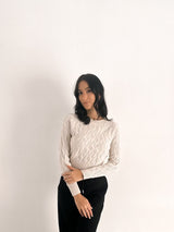 Maglione con trecce